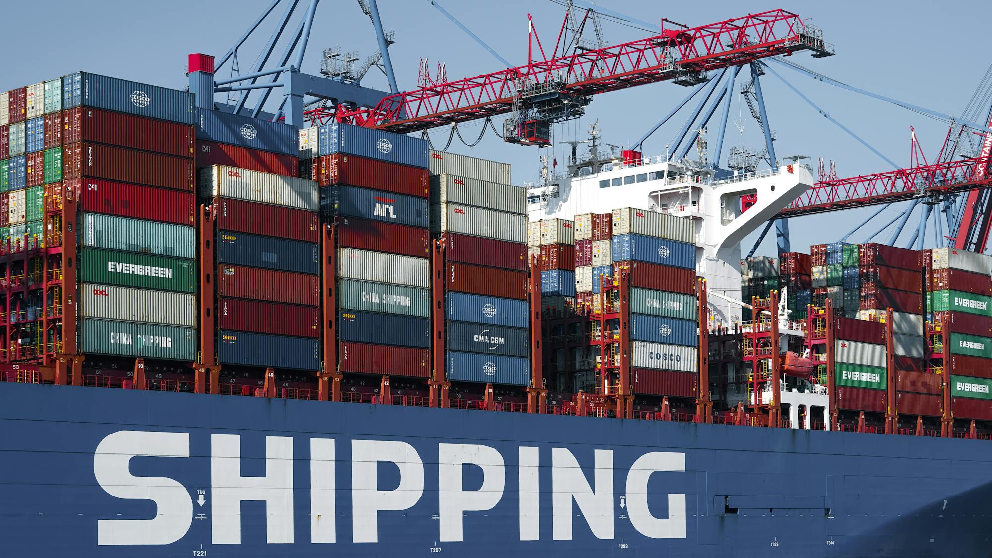 Container port with cargo ships and shipping containers